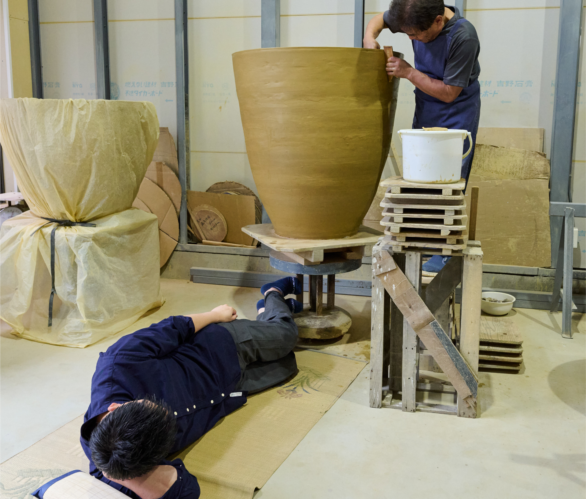Photo of Otani ware potters use a unique horizontal kick wheel – turned by foot to achieve the subtle speed control electric motors can’t match